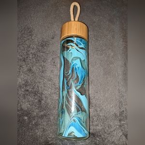 Glass water bottle with wood lid